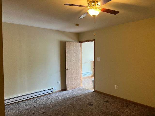 spare room with a ceiling fan, baseboards, carpet flooring, and baseboard heating