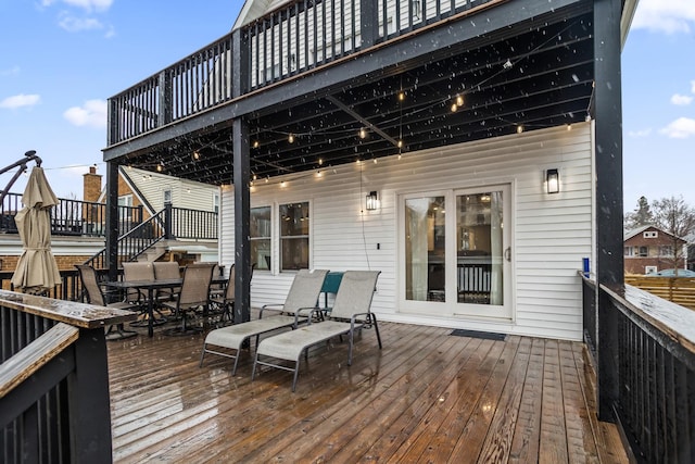 wooden deck with outdoor dining space