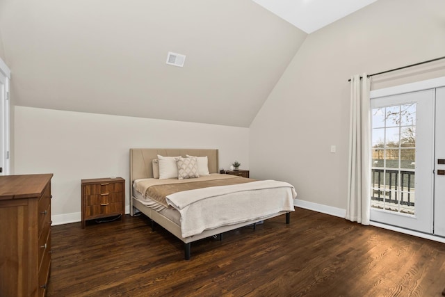 bedroom with access to outside, baseboards, vaulted ceiling, and dark wood-type flooring