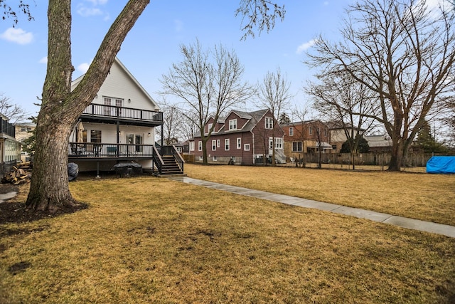 view of yard featuring a residential view and a wooden deck