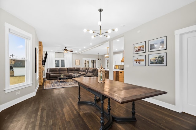 dining space featuring dark wood-type flooring, recessed lighting, and baseboards