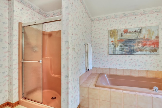 bathroom with a jetted tub, a shower stall, and wallpapered walls