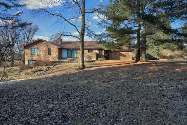 view of front of home featuring brick siding