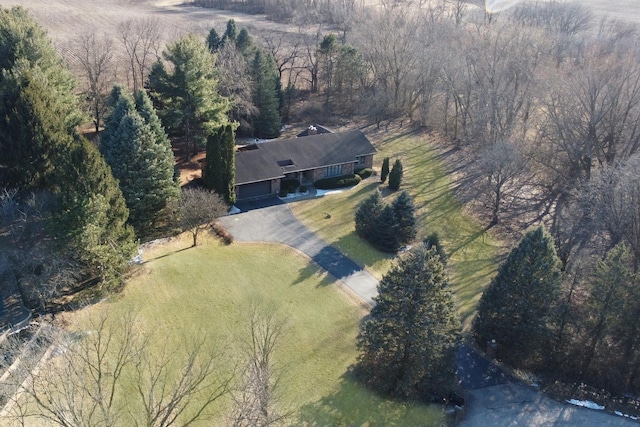 aerial view featuring a wooded view