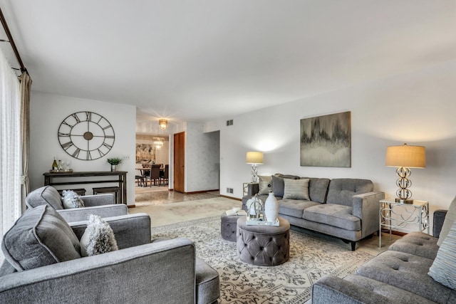 living room with visible vents and baseboards