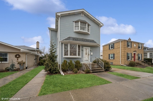 view of front of house with a front lawn