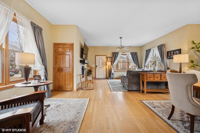 living room featuring ceiling fan and wood finished floors