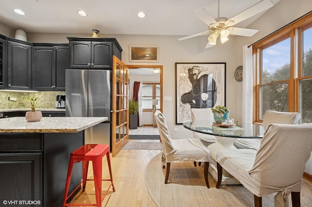 dining space featuring ceiling fan, light wood-type flooring, and recessed lighting