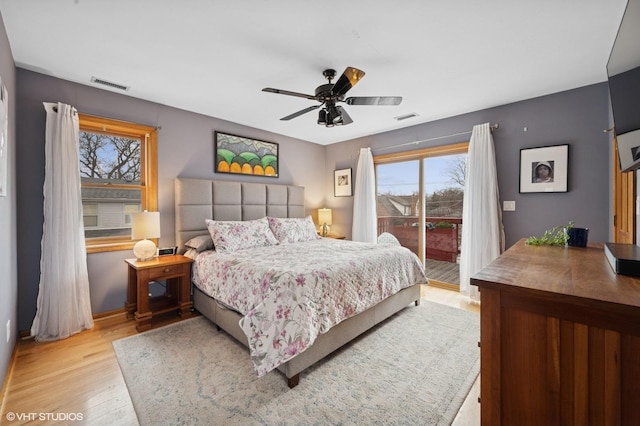 bedroom with access to exterior, a ceiling fan, visible vents, and wood finished floors