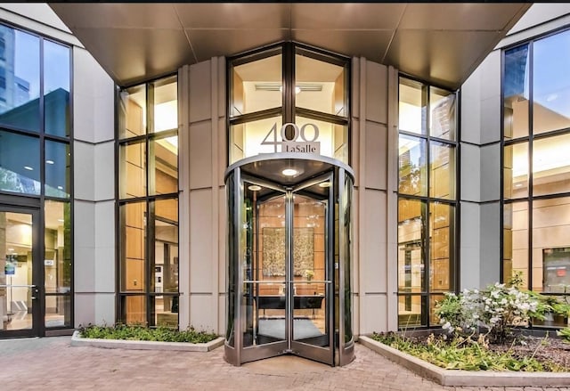 property entrance with visible vents and french doors