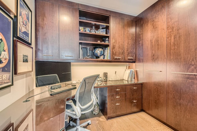 home office with light wood-style floors