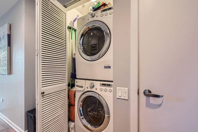 washroom with laundry area and stacked washing maching and dryer