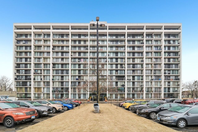 view of property with uncovered parking