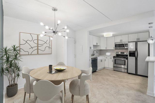 dining room with baseboards and an inviting chandelier