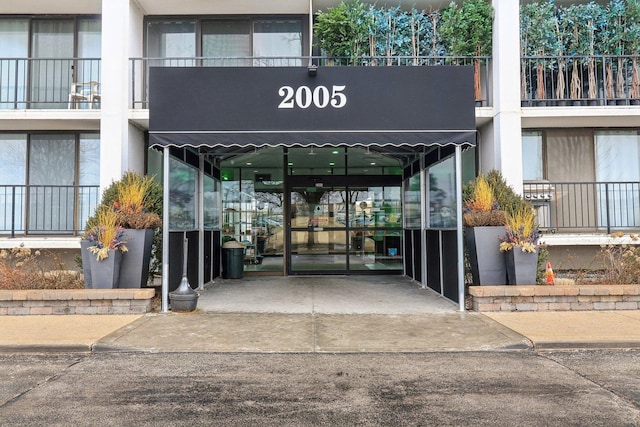 entrance to property featuring a carport and driveway