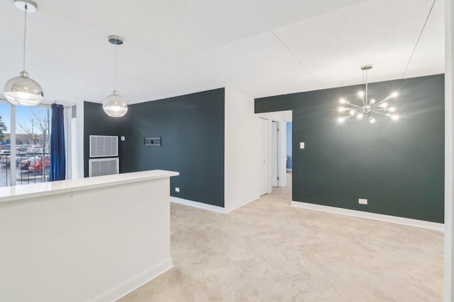 interior space with a notable chandelier and baseboards