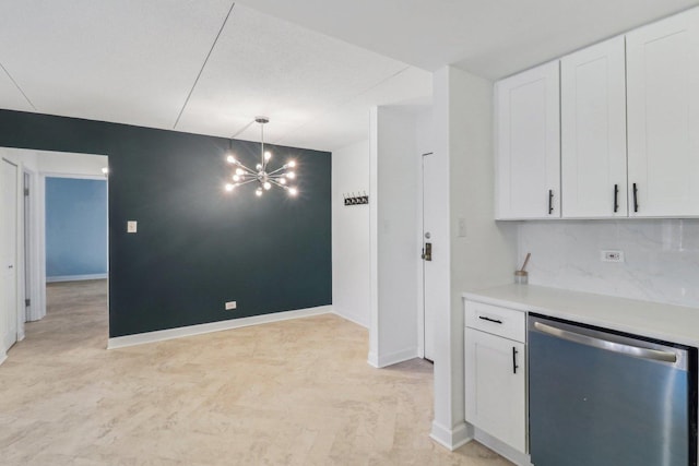 kitchen featuring an inviting chandelier, decorative backsplash, light countertops, white cabinets, and dishwasher