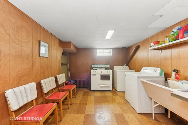 6938 W Jonquil Ter, Niles, IL 60714 - laundry room with separate washer and dryer, light flooring, radiator, wooden walls, and a sink
