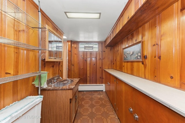 6938 W Jonquil Ter, Niles, IL 60714 - bar with baseboard heating, wood walls, and a sink