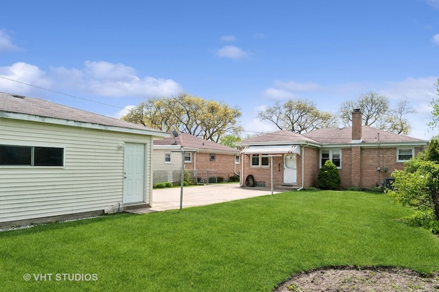 6938 W Jonquil Ter, Niles, IL 60714 - rear view of property with a patio, a chimney, and brick siding