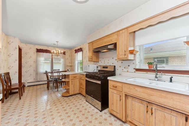 6938 W Jonquil Ter, Niles, IL 60714 - kitchen featuring stainless steel gas stove, under cabinet range hood, a sink, a peninsula, and a chandelier