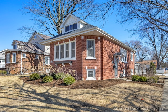 view of side of home with brick siding