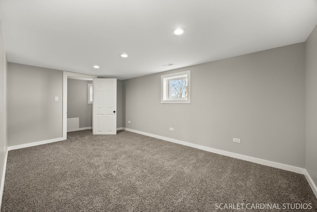 basement with carpet flooring, recessed lighting, visible vents, and baseboards