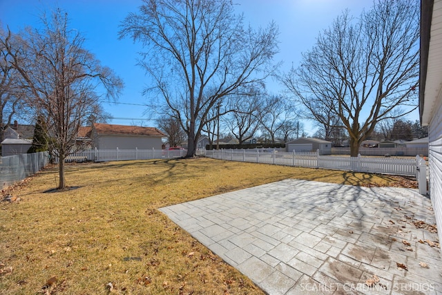 view of yard with a patio and a fenced backyard