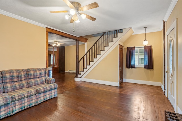 living area featuring hardwood / wood-style flooring, stairway, baseboards, and ornamental molding