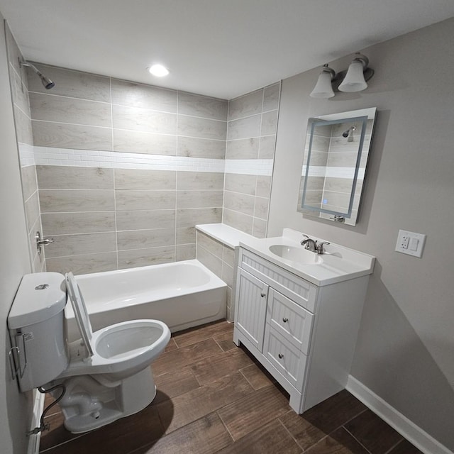 bathroom featuring shower / bath combination, toilet, wood tiled floor, vanity, and baseboards