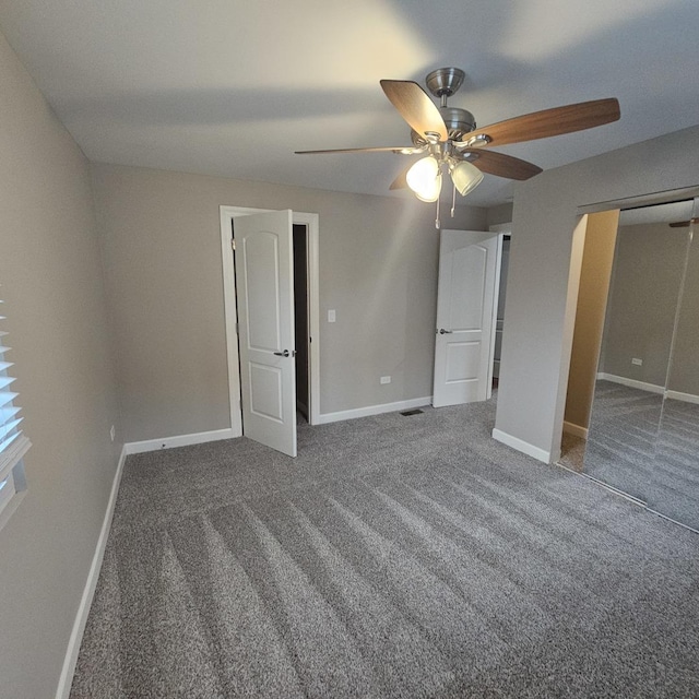 unfurnished bedroom with visible vents, baseboards, a ceiling fan, carpet floors, and a closet