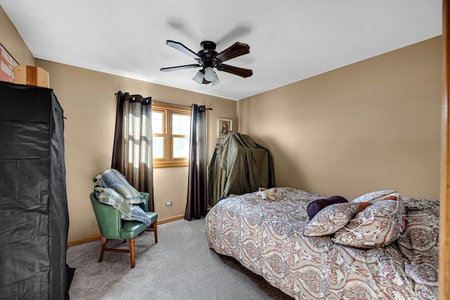 bedroom featuring carpet floors, baseboards, and a ceiling fan