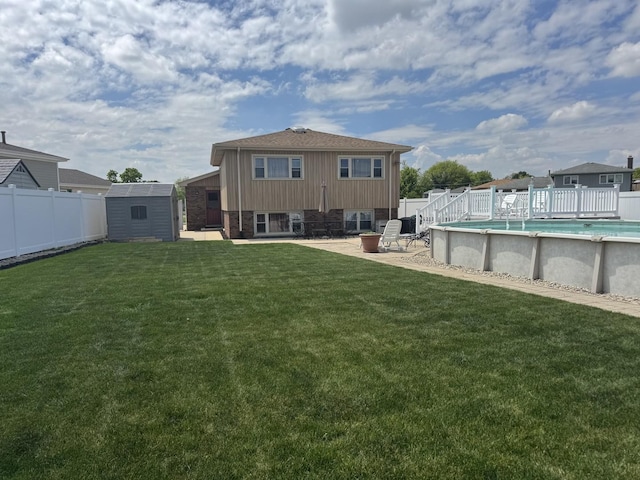 11621 S Merrion Ln, Merrionette Park, IL 60803 - rear view of house with a storage shed, an outdoor structure, and a patio