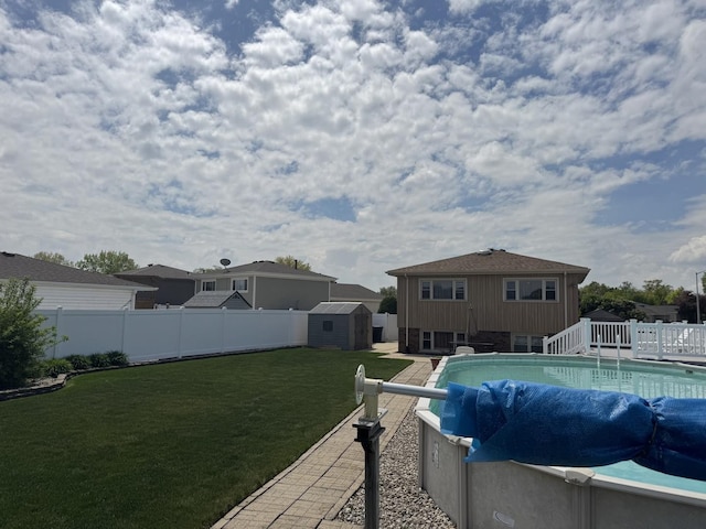 11621 S Merrion Ln, Merrionette Park, IL 60803 - view of swimming pool with a storage shed and an outbuilding