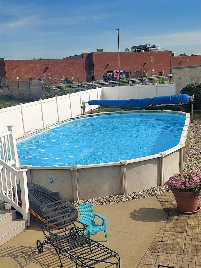 view of pool featuring a fenced in pool and fence