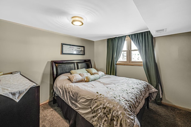 bedroom with carpet floors, baseboards, and visible vents