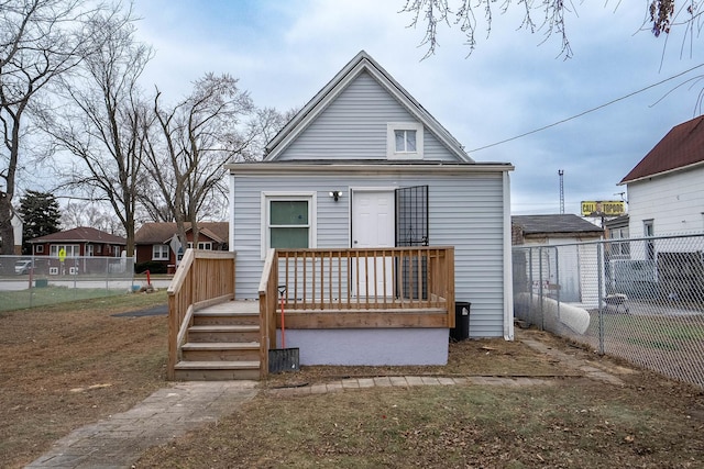 rear view of property with fence