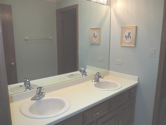 bathroom with double vanity and a sink