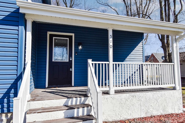 property entrance featuring covered porch