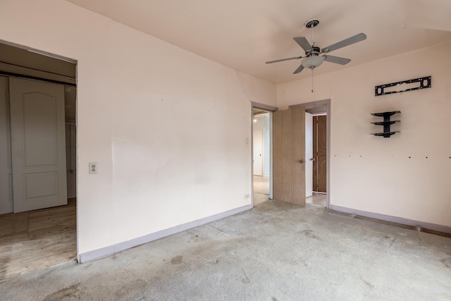 empty room featuring carpet floors and baseboards