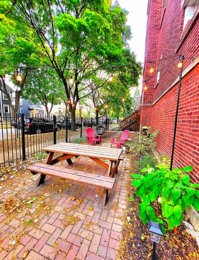 exterior space featuring a patio area and fence