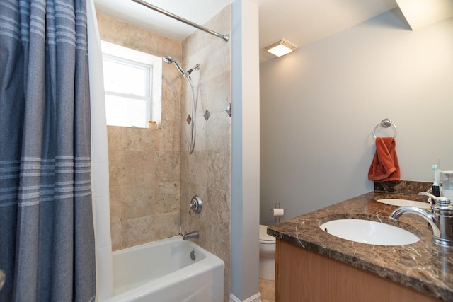 full bathroom with shower / bath combination with curtain, toilet, double vanity, and a sink