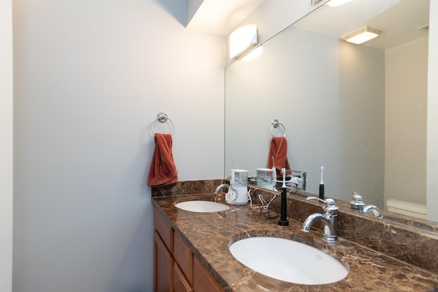 bathroom with double vanity and a sink