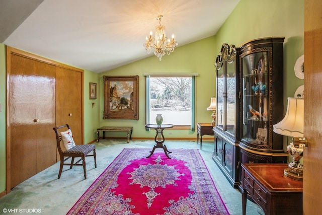 living area with vaulted ceiling, carpet floors, and a chandelier