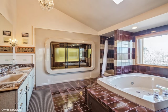 full bath with a whirlpool tub, a sink, a shower with shower curtain, and vaulted ceiling