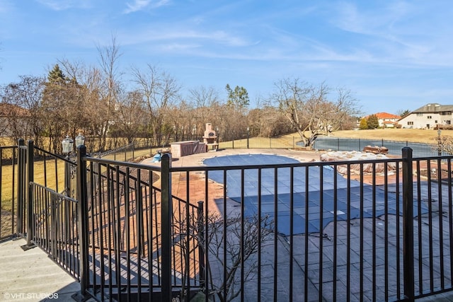 view of pool featuring a fenced in pool and fence