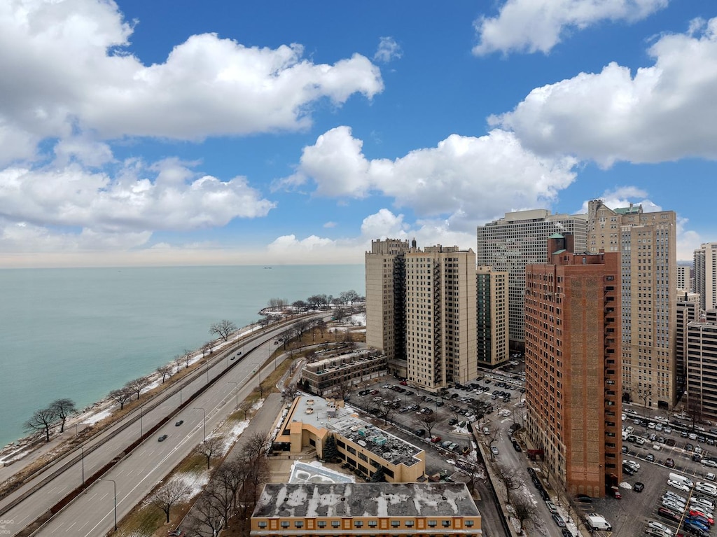 aerial view with a water view and a city view