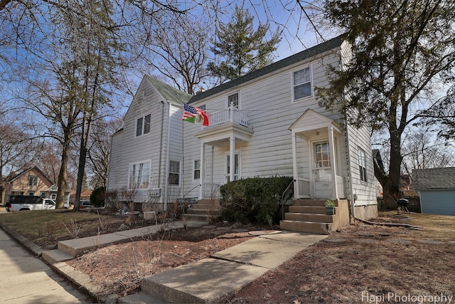 view of front of home featuring a balcony