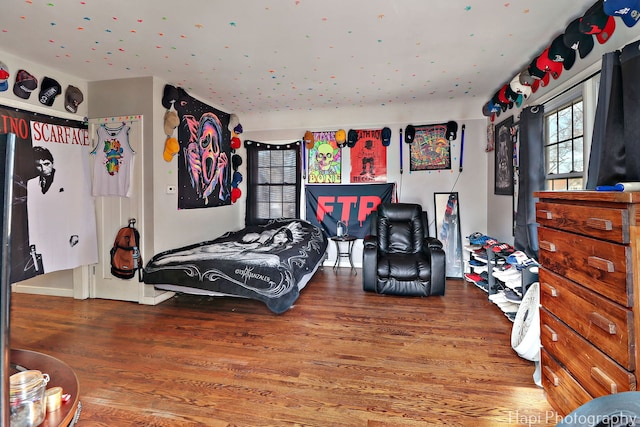 bedroom featuring wood finished floors