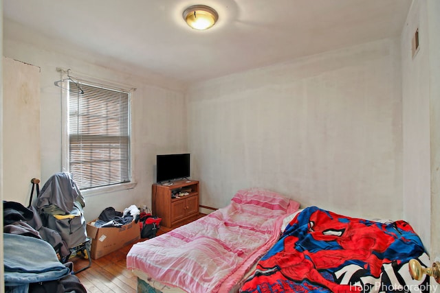 bedroom with light wood finished floors